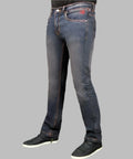 Blue jeans worn by a person on a gray background