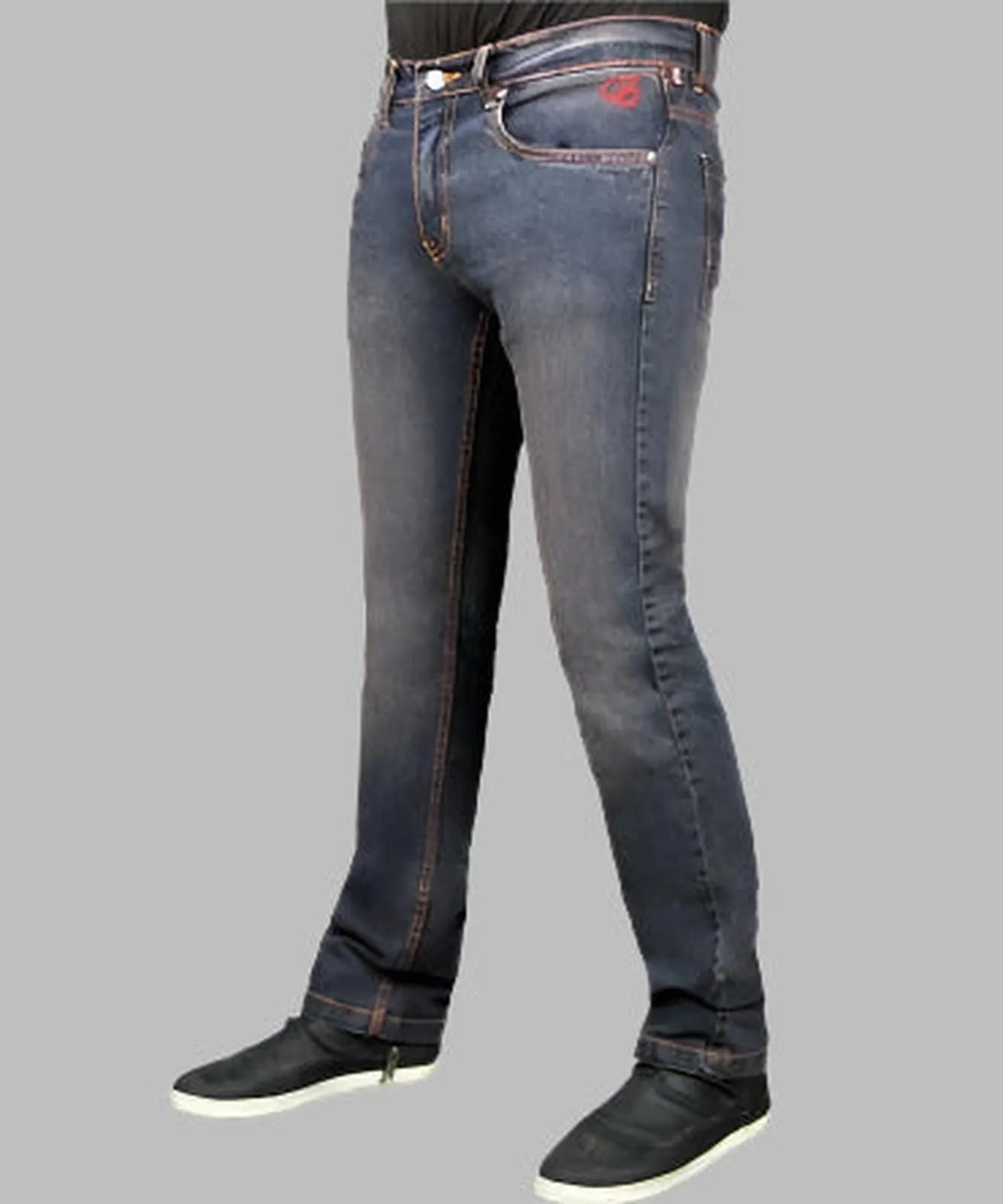 Blue jeans worn by a person on a gray background