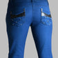 Blue jeans with decorative stitching on a gray background