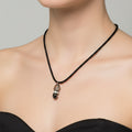 Necklace with a pendant on a dark surface