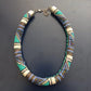 Beaded necklace with multicolor pattern on a dark background