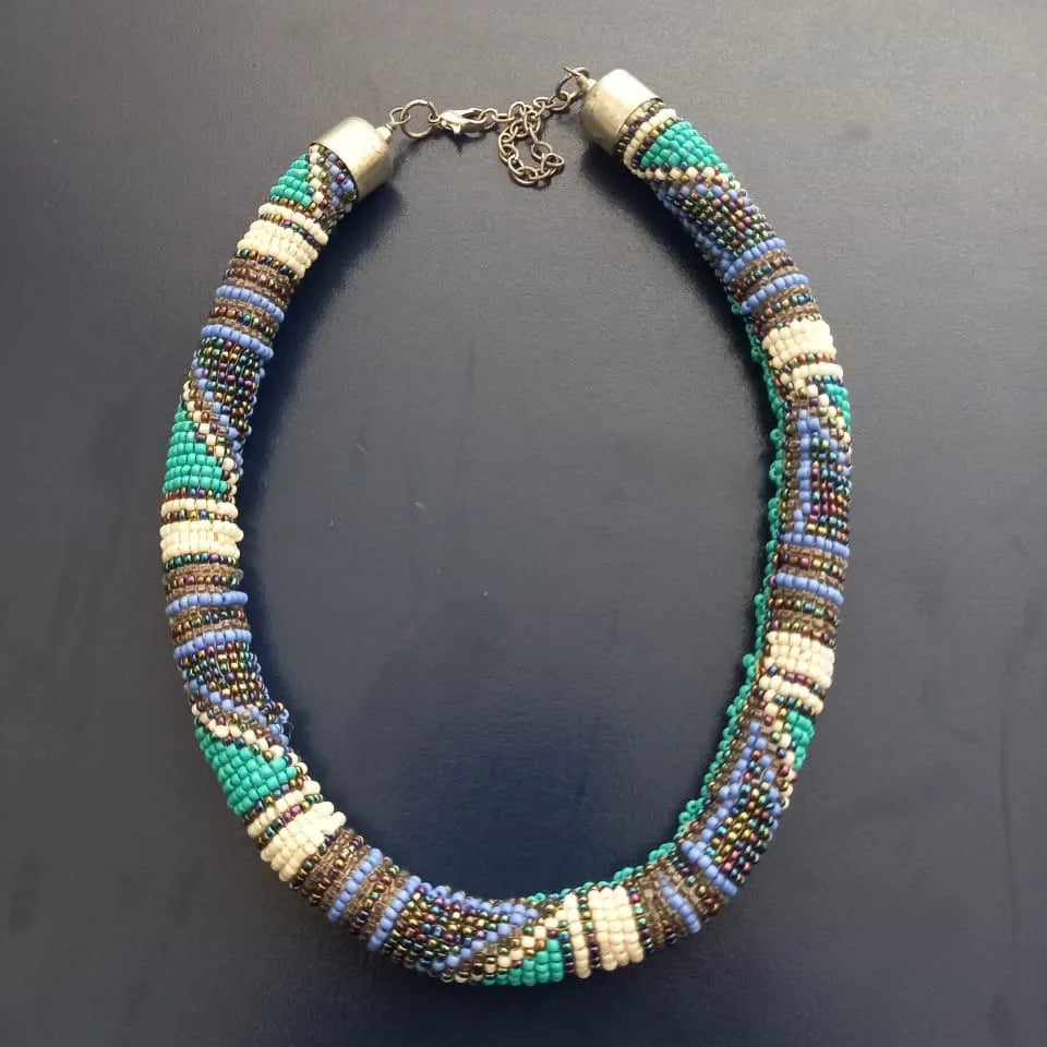 Beaded necklace with multicolor pattern on a dark background