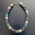 Beaded necklace with multicolor pattern on a dark background