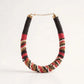 Multicolored beaded necklace on a white background