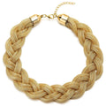Gold braided necklace on a white background