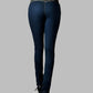 Dark blue jeans worn by a person on a gray background