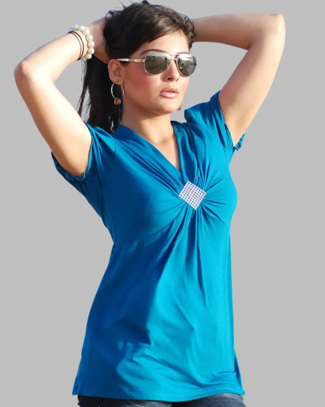 Turquoise cap sleeve knit top with brooch