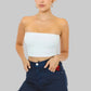 Woman wearing a white strapless top and navy denim shorts on a beige background with Element Jeans Co branding.