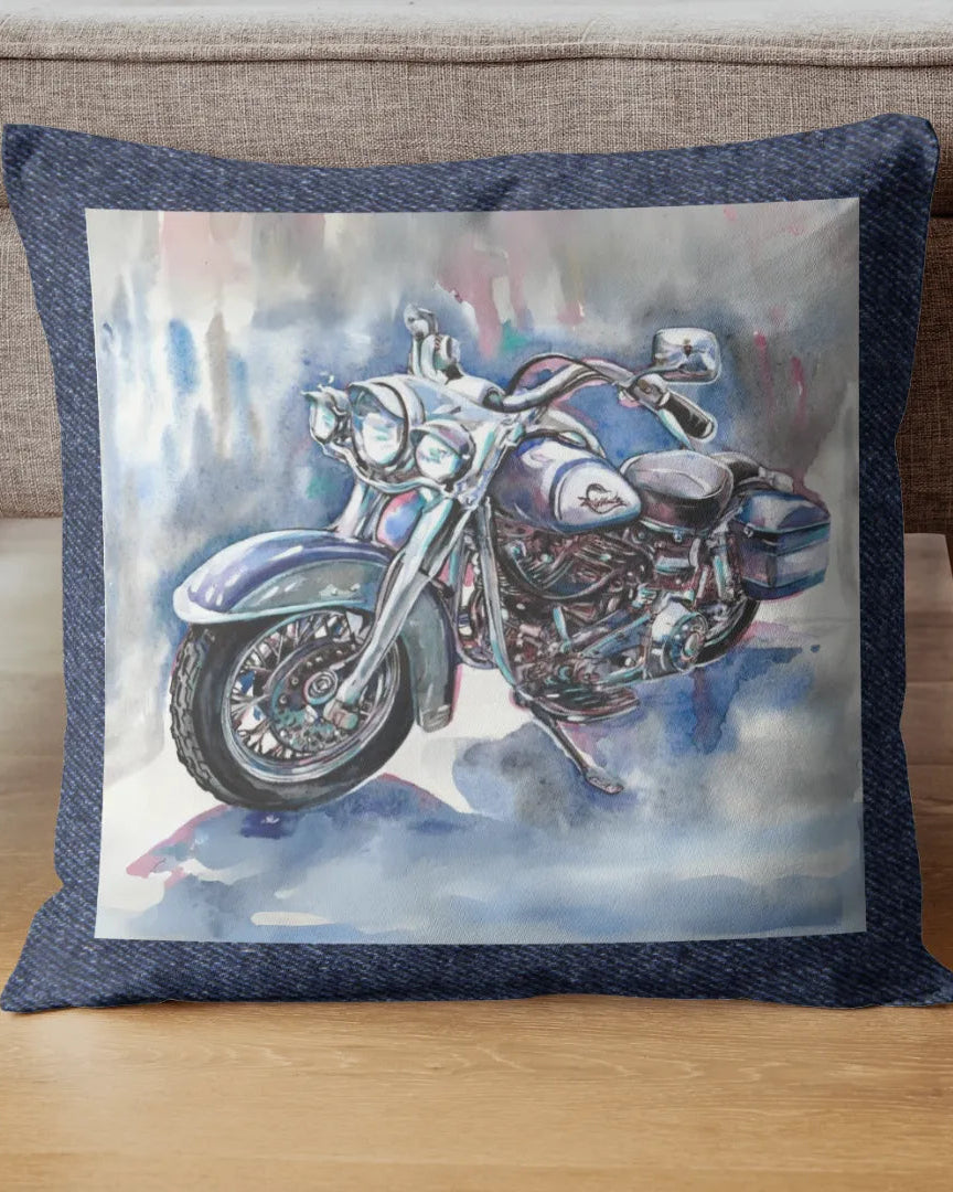 Decorative pillow with a motorcycle design on a wooden floor.