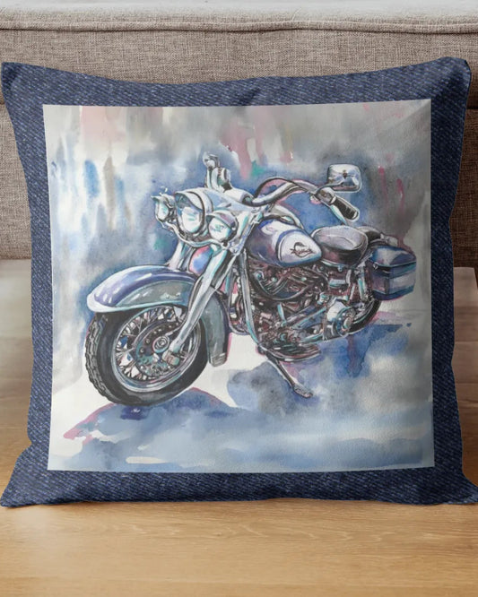 Decorative pillow with a motorcycle design on a wooden floor.