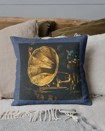 Decorative pillow with a vintage gramophone design on a couch.