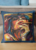 Colorful pillow with artistic depiction of a face on a wooden surface.