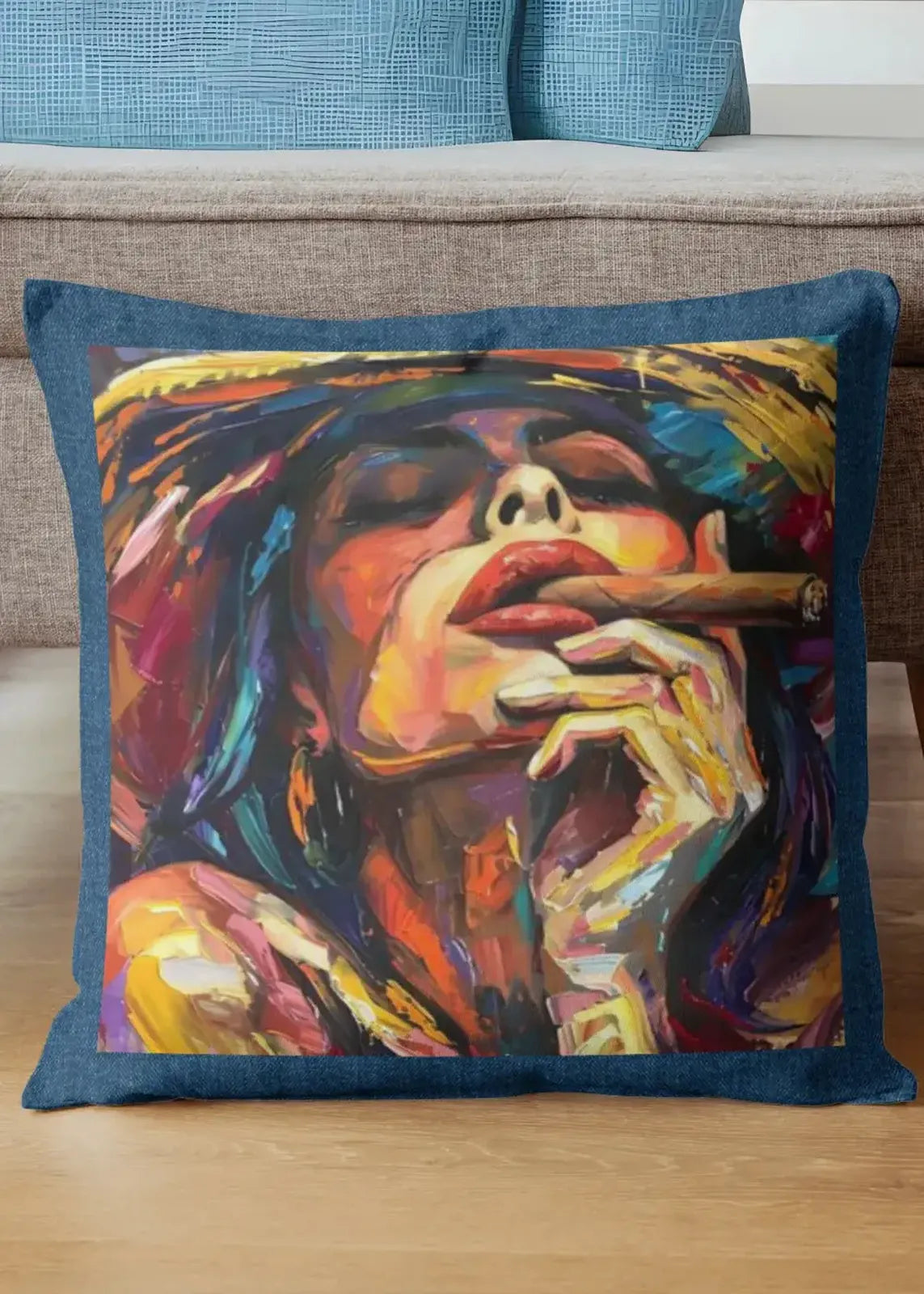 Colorful pillow with artistic depiction of a face on a wooden surface.