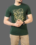 Person wearing a green t-shirt with yellow text on a gray background