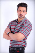 Man wearing a gray and red striped shirt with arms crossed on a white background
