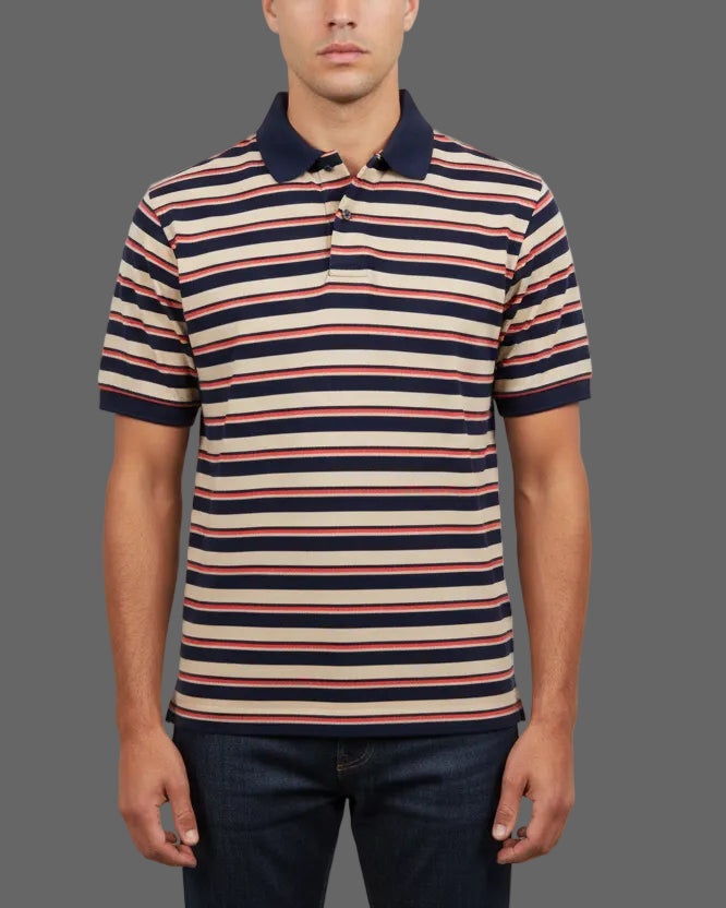 Man wearing a striped polo shirt against a gray background