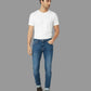 Man wearing a white t-shirt and blue jeans on a white background