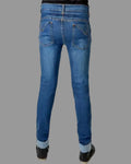 Blue jeans worn by a person on a white background