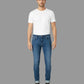 Man wearing a white t-shirt and blue jeans on a white background