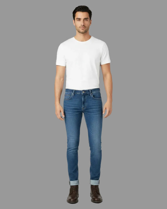 Man wearing a white t-shirt and blue jeans on a white background