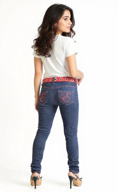 Woman wearing blue jeans with red accents on a white background