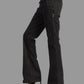 Black bell-bottom pants with a pink belt on a white background