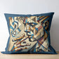 Decorative pillow with abstract design of a face and pipes on a wooden surface.