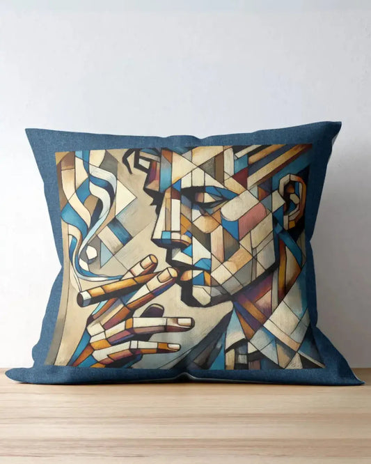 Decorative pillow with abstract design of a face and pipes on a wooden surface.