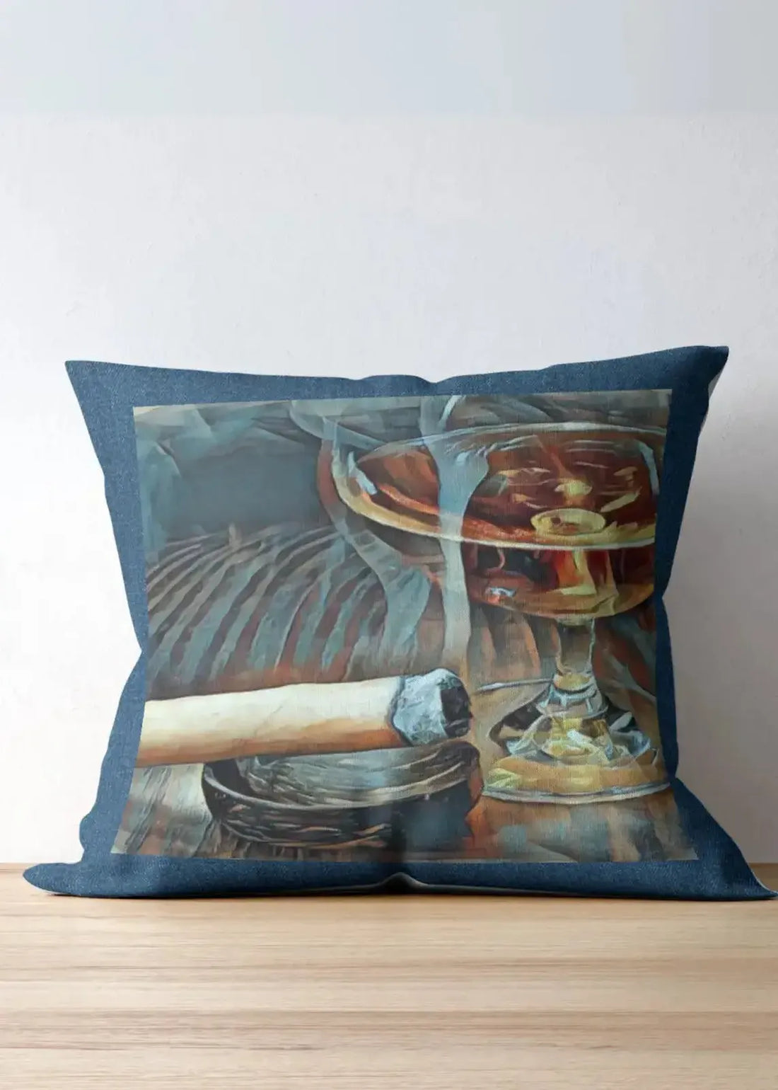 Decorative pillow with a glass of whiskey and a cigar on a couch.