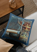 Decorative pillow with a glass of whiskey and a cigar on a couch.
