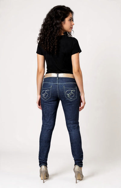 Woman wearing blue jeans with a brand logo on a white background