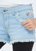 Light blue denim shorts with frayed hem on a white background