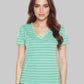 Woman wearing a green striped t-shirt against a gray background