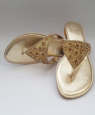 Golden flat slippers with stone embellishment