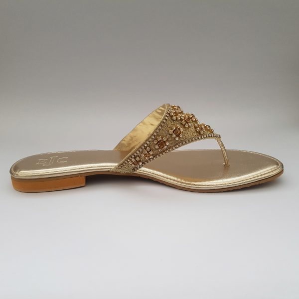Golden flat slippers with stone embellishment